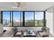 Relax on this condo's inviting balcony with panoramic water views from the comfort of cushioned seating at 770 S Palm Ave # 404, Sarasota, FL 34236
