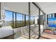 Balcony with sliding glass doors, offering a serene view of the open water and integrated indoor-outdoor living at 770 S Palm Ave # 404, Sarasota, FL 34236