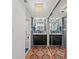Modern bathroom with dual sinks, tiled walls, and a glass-enclosed shower at 770 S Palm Ave # 404, Sarasota, FL 34236
