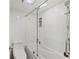 Modern bathroom featuring a shower-tub combination with glass door and white tile surround at 770 S Palm Ave # 404, Sarasota, FL 34236