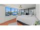 Bright main bedroom features water views, a ceiling fan, and custom built-ins at 770 S Palm Ave # 404, Sarasota, FL 34236