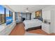 Bedroom with floor to ceiling windows and adjacent office space with stunning views at 770 S Palm Ave # 404, Sarasota, FL 34236