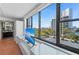 Bright bedroom featuring a large window with city views and access to an ensuite bathroom at 770 S Palm Ave # 404, Sarasota, FL 34236