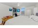 Bright bedroom featuring a ceiling fan and mirrored closet doors at 770 S Palm Ave # 404, Sarasota, FL 34236