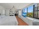 Bright bedroom featuring a large window with city views and access to an ensuite bathroom at 770 S Palm Ave # 404, Sarasota, FL 34236