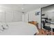 Bright bedroom featuring a ceiling fan and mirrored closet doors at 770 S Palm Ave # 404, Sarasota, FL 34236