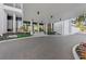 Inviting building entrance with a covered drive-through, lush landscaping, and a clean modern design at 770 S Palm Ave # 404, Sarasota, FL 34236