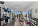 Well-equipped fitness center featuring state-of-the-art exercise machines, weights, and a mirrored wall at 770 S Palm Ave # 404, Sarasota, FL 34236
