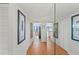 Hallway with tile flooring and closet with a mirror opening to living space and views at 770 S Palm Ave # 404, Sarasota, FL 34236