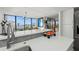 Modern kitchen features white cabinetry, stainless steel appliances, and a beautiful waterfront view at 770 S Palm Ave # 404, Sarasota, FL 34236
