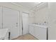 Functional laundry room featuring a washer, dryer, and ample space for laundry tasks at 770 S Palm Ave # 404, Sarasota, FL 34236