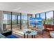 Spacious living room featuring expansive windows with breathtaking views of the water at 770 S Palm Ave # 404, Sarasota, FL 34236