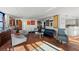 Spacious living room offers plentiful light, water views, tile flooring, and neutral paint at 770 S Palm Ave # 404, Sarasota, FL 34236