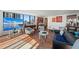 Large living room with water views, comfortable seating, and views through expansive windows at 770 S Palm Ave # 404, Sarasota, FL 34236