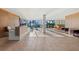 Welcoming lobby area with stylish seating and a reception desk near expansive windows with water views at 770 S Palm Ave # 404, Sarasota, FL 34236