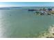 Waterfront aerial view of the ocean with boats sailing near the shoreline at 770 S Palm Ave # 404, Sarasota, FL 34236