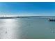 Scenic aerial view of the ocean and waterfront with a bridge in the distance at 770 S Palm Ave # 404, Sarasota, FL 34236