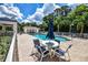 Community pool area featuring a large pool, lounge chairs, and covered seating at 780 Montrose Dr # 201, Venice, FL 34293