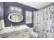 Charming bathroom with vanity, decorative shower curtain, and bright lighting at 809 Montrose Dr # 203, Venice, FL 34293