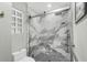 Modern shower with marble-like tiling, a built-in bench, and a sleek glass enclosure at 809 Montrose Dr # 203, Venice, FL 34293