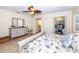 Spacious bedroom with a dresser and views of the closet and bathroom at 8170 Casa De Meadows Dr, Englewood, FL 34224