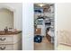 Closet with ample shelving, storage, and tiled flooring at 8170 Casa De Meadows Dr, Englewood, FL 34224