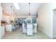 Open concept dining area connected to kitchen with natural lighting and backyard views at 8170 Casa De Meadows Dr, Englewood, FL 34224