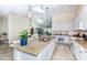 Eat-in kitchen with granite countertops, stainless steel appliances, and natural lighting with backyard view at 8170 Casa De Meadows Dr, Englewood, FL 34224