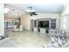 Inviting living room featuring a built-in entertainment center and tile flooring at 8170 Casa De Meadows Dr, Englewood, FL 34224