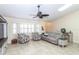 Comfortable living room showcases tile floors and bright natural light through the windows at 8170 Casa De Meadows Dr, Englewood, FL 34224