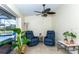 Bright sitting room with recliners and views of screened in pool area at 8170 Casa De Meadows Dr, Englewood, FL 34224
