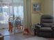 Inviting living room showcasing a view into the dining area, and comfortable recliner chair at 822 Bogie St, Venice, FL 34285