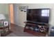 Cozy living room featuring modern tv and furnishings on wood-look flooring at 822 Bogie St, Venice, FL 34285