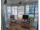 Bright sun room with large windows, allowing ample natural light to illuminate the living space at 822 Bogie St, Venice, FL 34285