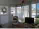 Cozy sun room with bright windows, a comfortable chair, and stylish decor at 822 Bogie St, Venice, FL 34285