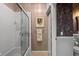 Well-decorated bathroom showing neutral tone paint with wallpaper accent, plus a shower and tub at 902 Tartan Dr # 29, Venice, FL 34293