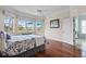 Bright bedroom offers a large window with great views, ample space, and a ceiling fan at 902 Tartan Dr # 29, Venice, FL 34293