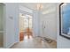 Open foyer with tile flooring, a view of the office, and a bright white front door at 902 Tartan Dr # 29, Venice, FL 34293
