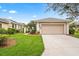 Well-maintained home with manicured lawn and two car garage in a desirable neighborhood at 902 Tartan Dr # 29, Venice, FL 34293