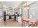 Sunlit kitchen with an adjacent breakfast nook offers a cozy spot for casual dining at 902 Tartan Dr # 29, Venice, FL 34293