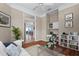 Inviting living room with hardwood floors, a built-in office space, and an open concept layout at 902 Tartan Dr # 29, Venice, FL 34293