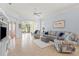 Spacious living room with a serene color palette, comfortable seating, and ample natural light at 902 Tartan Dr # 29, Venice, FL 34293