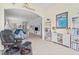 Sitting area with built in shelves and chair at 902 Tartan Dr # 29, Venice, FL 34293
