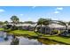 Rear view of home with screened in porch overlooking beautiful water view at 902 Tartan Dr # 29, Venice, FL 34293