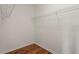 Spacious walk-in closet with laminate flooring and wire shelving for organized storage at 902 Tartan Dr # 29, Venice, FL 34293