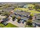 Aerial view showcases this lovely golf course community, including a serene lake and lush landscaping at 903 Gondola Park Dr # 903, Venice, FL 34292