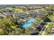 Aerial view of a condo community with a tennis court, golf course, and landscaped grounds at 903 Gondola Park Dr # 903, Venice, FL 34292