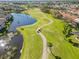 Scenic aerial view of golf course with lush green fairways, pristine lakes, and well-maintained landscaping at 903 Gondola Park Dr # 903, Venice, FL 34292