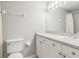 Well-lit bathroom with a sink, mirror and toilet at 903 Gondola Park Dr # 903, Venice, FL 34292