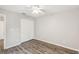 Empty bedroom featuring a ceiling fan, light gray walls, and hardwood floors at 903 Gondola Park Dr # 903, Venice, FL 34292